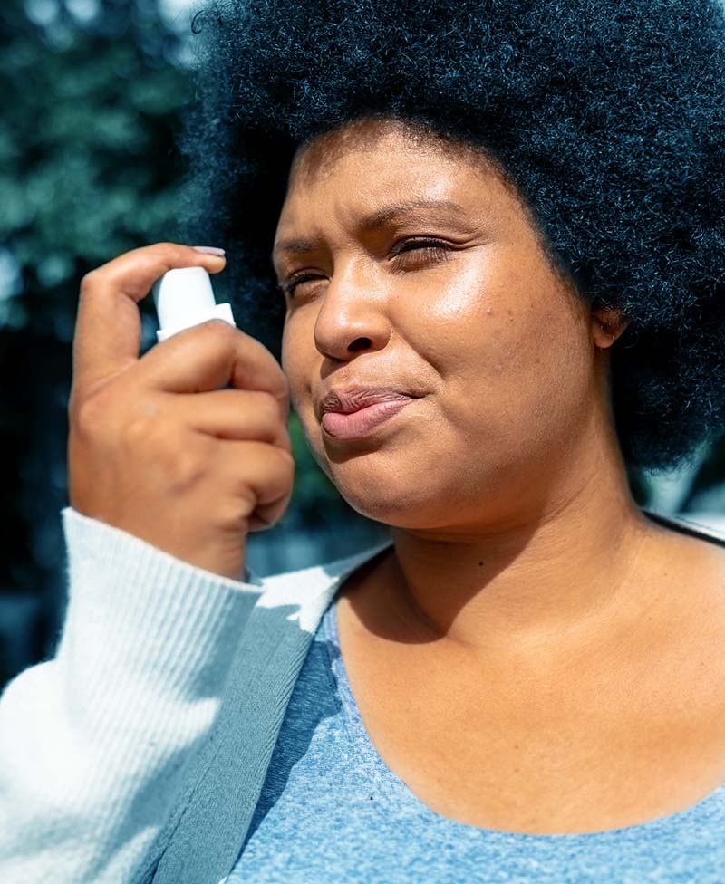 Lady with COPD using inhaler
